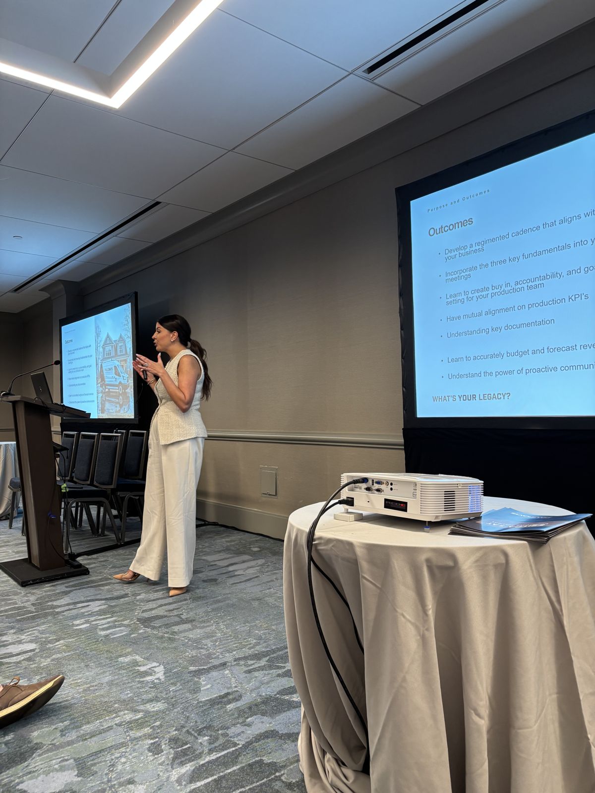 Kori Medeiros speaking at a Paul Davis industry event